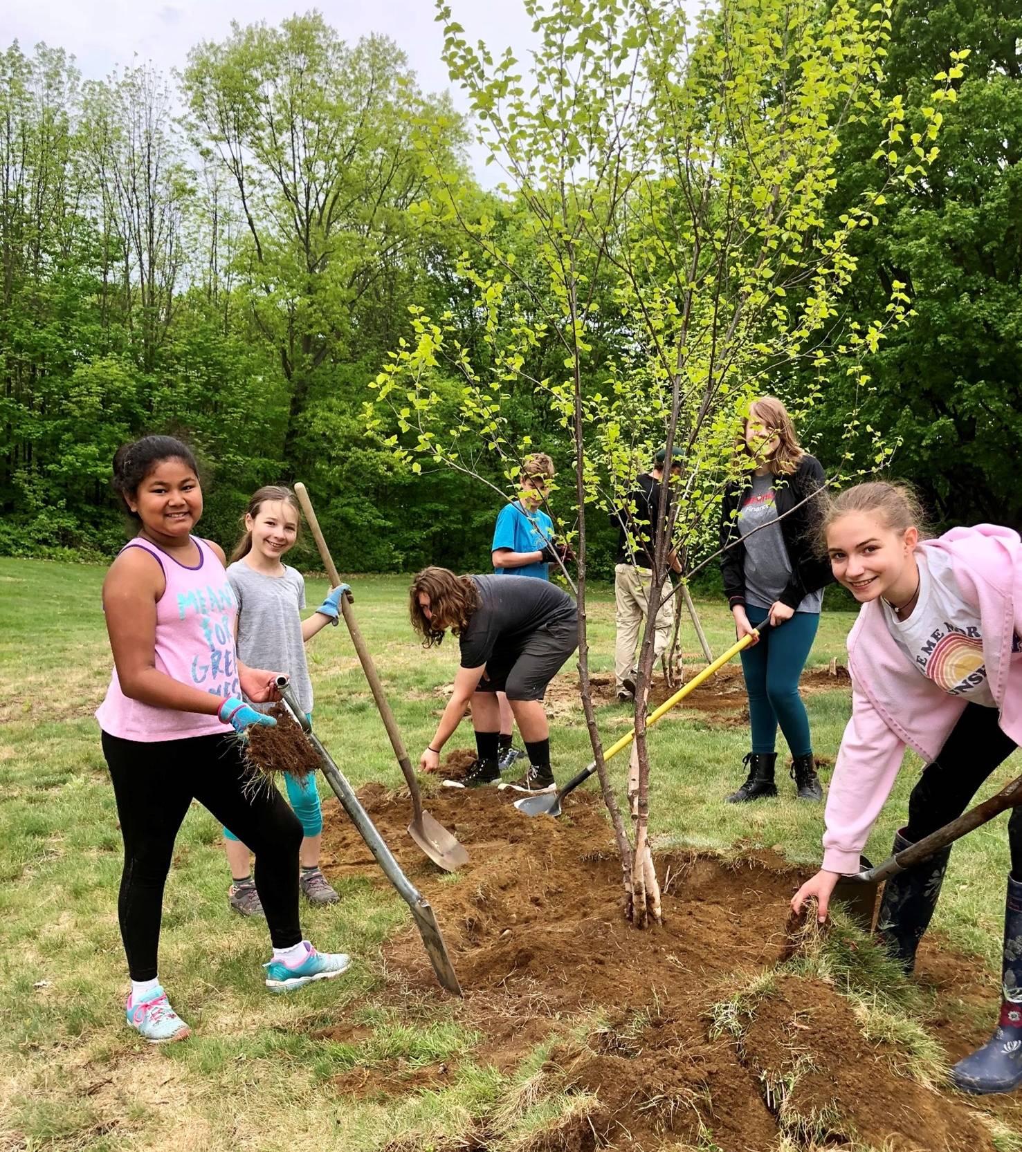 Vermont Commons School class planting trees in Szymanski Park - Copy